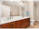 Bathroom with double sink, dark wood vanity, and a mirror at 7250 Nc 751 Highway, #1205, Durham, NC 27707