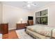 Bedroom features a ceiling fan, TV, and windows that let in ample natural light at 7250 Nc 751 Highway, #1205, Durham, NC 27707