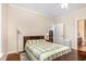 Bedroom with hardwood floors and neutral paint. Doorways lead to other rooms in the house at 7250 Nc 751 Highway, #1205, Durham, NC 27707
