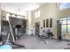 Well-equipped fitness center featuring various exercise machines, weights, and a stairwell leading to more equipment at 7250 Nc 751 Highway, #1205, Durham, NC 27707