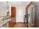 Well-designed kitchen with stainless steel appliances, granite counters, and wood cabinets at 7250 Nc 751 Highway, #1205, Durham, NC 27707