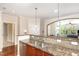 Open kitchen area with granite countertops and view into the living room at 7250 Nc 751 Highway, #1205, Durham, NC 27707