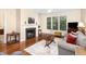 Bright living room showcasing a fireplace, hardwood floors, and natural light at 7250 Nc 751 Highway, #1205, Durham, NC 27707