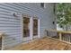 New wooden deck leads to double doors accessing the house at 8 Great Oak Ct, Durham, NC 27713