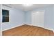 Bright bedroom with wood-look floors and a large window for ample natural light at 8 Great Oak Ct, Durham, NC 27713