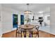 Charming dining room features hardwood floors, chandelier, and access to the kitchen and back deck at 8 Great Oak Ct, Durham, NC 27713