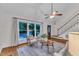 Cozy living room featuring hardwood floors, stylish seating, and large windows for ample light at 8 Great Oak Ct, Durham, NC 27713