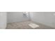 Bedroom with neutral carpet, a window, and base molding along the walls, great for relaxing at 807 Outlaw Ave # 19, Durham, NC 27703
