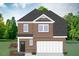 Charming brick two-story home with a two-car garage and a beautifully landscaped front yard at 807 Outlaw Ave # 19, Durham, NC 27703