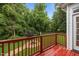 Inviting back deck overlooking the backyard and firepit, with views of mature trees at 8116 Mosby Way, Willow Springs, NC 27592