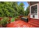 Comfortable back deck with outdoor furniture and a view of the lush backyard at 8116 Mosby Way, Willow Springs, NC 27592