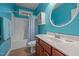 Bathroom with stylish blue walls, a vanity, mirror and a shower and tub combination at 8116 Mosby Way, Willow Springs, NC 27592