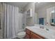 Light and bright bathroom features a vanity, mirror, toilet, and bathtub with a shower at 8116 Mosby Way, Willow Springs, NC 27592