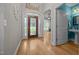Entryway with hardwood floors, a decorative front door, and a view of the adjacent living spaces at 8116 Mosby Way, Willow Springs, NC 27592