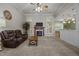 Spacious living room with neutral carpet, fireplace, and large windows at 8116 Mosby Way, Willow Springs, NC 27592