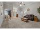 Spacious living room with neutral carpet, high ceilings, and comfortable seating at 8116 Mosby Way, Willow Springs, NC 27592