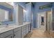 Bright main bathroom with double sinks, walk-in closet and glass-doored shower at 8116 Mosby Way, Willow Springs, NC 27592