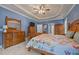 Comfortable main bedroom with blue walls, light-colored carpet, and lots of storage at 8116 Mosby Way, Willow Springs, NC 27592