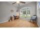 Bright office space with a large arched window, hardwood floors, and a ceiling fan at 8116 Mosby Way, Willow Springs, NC 27592