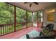 Relaxing screened porch overlooking the private backyard with seating at 8116 Mosby Way, Willow Springs, NC 27592