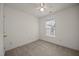 Carpeted bedroom with a ceiling fan and natural light from the window at 8151 Rhiannon Rd, Raleigh, NC 27613