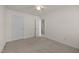 Bedroom features carpet and white walls with a closet and an open door at 8151 Rhiannon Rd, Raleigh, NC 27613