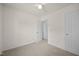 Bedroom with neutral carpet and fan, conveniently located near bathroom at 8151 Rhiannon Rd, Raleigh, NC 27613