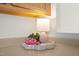 Close up of the countertop decor with a small table lamp and decorative pink flowers at 8151 Rhiannon Rd, Raleigh, NC 27613