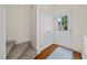 Entryway featuring beautiful hardwood floors, closet, stairs, and bright natural light at 8151 Rhiannon Rd, Raleigh, NC 27613