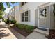 Close-up of a house exterior highlighting manicured landscaping and a welcoming front door at 8151 Rhiannon Rd, Raleigh, NC 27613