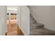 Hallway view with a stairwell and access to the backyard at 8151 Rhiannon Rd, Raleigh, NC 27613