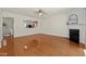 Spacious living room with access to the kitchen and a fireplace feature at 8151 Rhiannon Rd, Raleigh, NC 27613