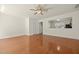 View of the open living room with laminate floors and access to the kitchen at 8151 Rhiannon Rd, Raleigh, NC 27613