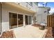Concrete backyard patio with sliding glass doors and a door to a utility room at 8151 Rhiannon Rd, Raleigh, NC 27613