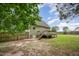 Backyard with deck, fencing, green siding and grass at 816 Kimpton Ct, Fuquay Varina, NC 27526