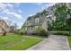 A side view of a well-maintained home featuring a spacious lawn and lush landscaping at 816 Kimpton Ct, Fuquay Varina, NC 27526