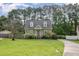 Charming two-story home featuring dormer windows, a pink door, and a well-manicured lawn at 816 Kimpton Ct, Fuquay Varina, NC 27526