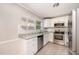 Charming kitchen with white cabinets, stainless steel appliances, and stylish backsplash at 816 Kimpton Ct, Fuquay Varina, NC 27526