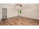 Spacious living room with wood-look flooring, large windows, and ample natural light at 816 Kimpton Ct, Fuquay Varina, NC 27526