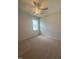 Carpeted bedroom featuring natural light from a large window and a ceiling fan at 85 Bald Cypress Ln, Youngsville, NC 27596