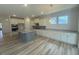 Spacious kitchen with stainless appliances, a large island, and ample counter space at 85 Bald Cypress Ln, Youngsville, NC 27596