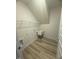 The laundry room features wood-look floors and a utility sink at 85 Bald Cypress Ln, Youngsville, NC 27596
