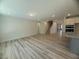 Open living area with hardwood floors and modern recessed lighting at 85 Bald Cypress Ln, Youngsville, NC 27596