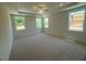 Spacious main bedroom with plush carpeting, recessed lighting, and multiple windows at 85 Bald Cypress Ln, Youngsville, NC 27596