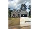 Charming single-Gathering home featuring a brick facade, well-manicured lawn, and attached two-car garage at 95 Slippery Elm Rd, Youngsville, NC 27596