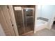 Modern bathroom featuring a glass-enclosed shower and a separate soaking tub at 966 Airedale Trl, Garner, NC 27529