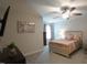 Cozy bedroom with a ceiling fan, art, and a bed with decorative pillows at 966 Airedale Trl, Garner, NC 27529