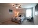 Bedroom features a decorative bedspread, a window with natural light, chair and bedside table at 966 Airedale Trl, Garner, NC 27529