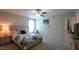 Bedroom features a decorative bedspread, nightstands, and a view to a window with natural light at 966 Airedale Trl, Garner, NC 27529