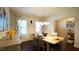 Traditional dining room with a chandelier, six chairs, and decorative curtains at 966 Airedale Trl, Garner, NC 27529